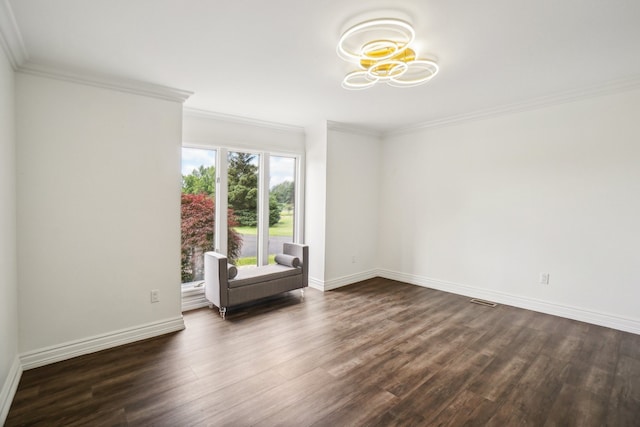 empty room with baseboards, dark wood-style floors, visible vents, and ornamental molding