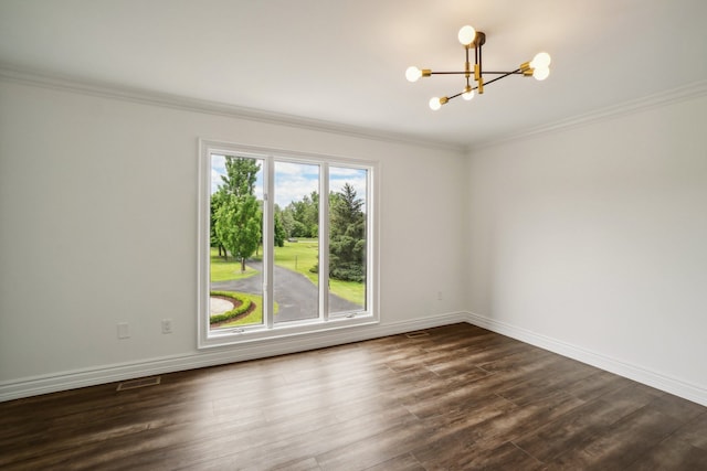 empty room with visible vents, baseboards, a chandelier, dark wood finished floors, and ornamental molding