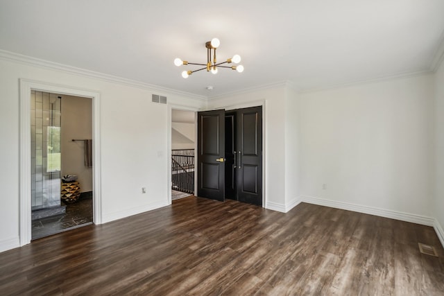 unfurnished bedroom with visible vents, ornamental molding, wood finished floors, baseboards, and a chandelier