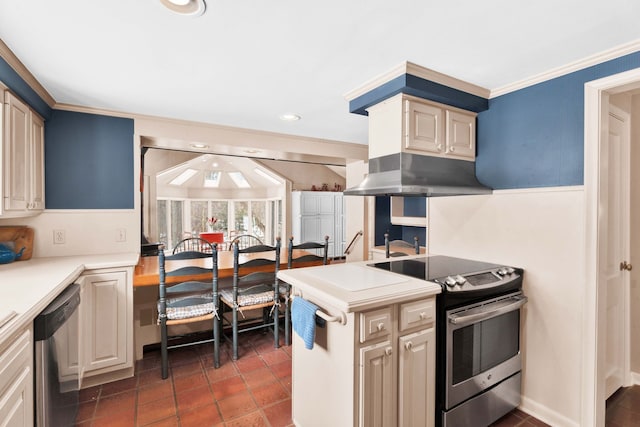 kitchen featuring light countertops, ornamental molding, recessed lighting, appliances with stainless steel finishes, and tile patterned floors