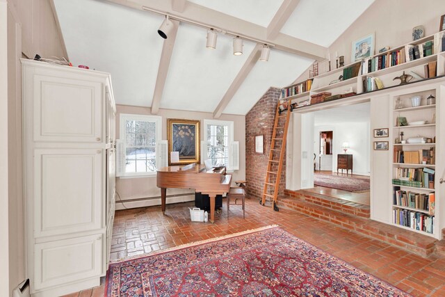 office area with a baseboard heating unit, lofted ceiling with beams, and brick floor