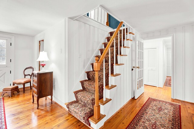 staircase featuring wood-type flooring