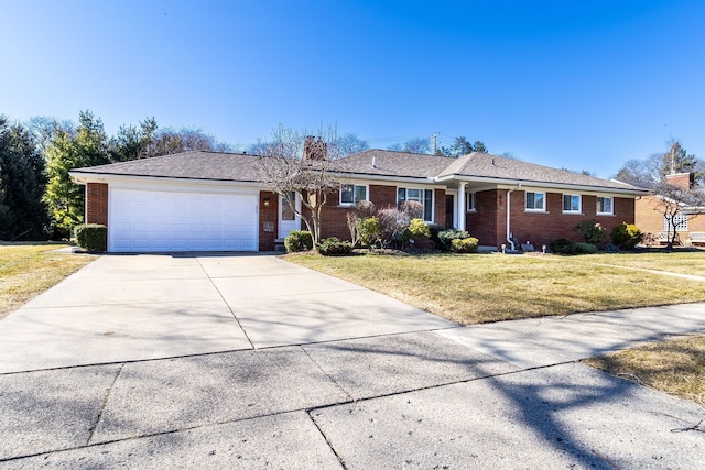 ranch-style home with brick siding, a garage, driveway, and a front yard