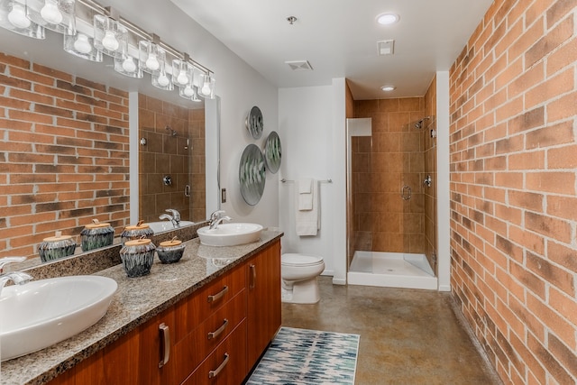 full bathroom featuring a shower stall, toilet, visible vents, and a sink