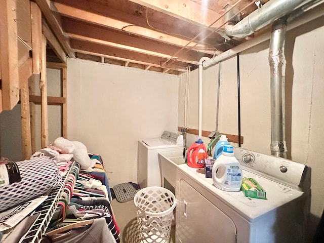 laundry area featuring washing machine and dryer and laundry area