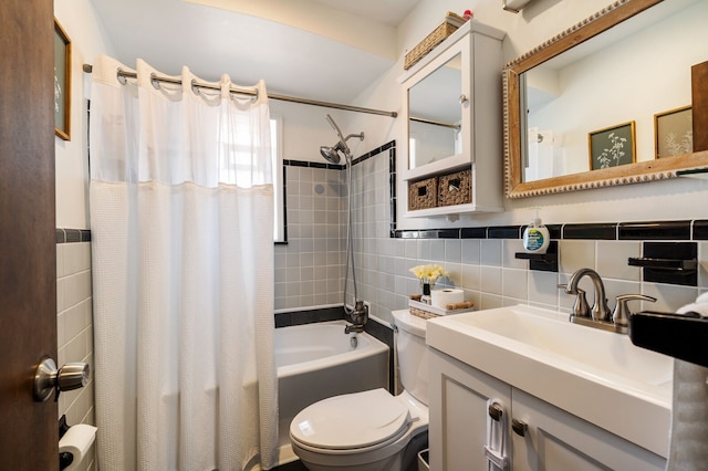 full bath with vanity, toilet, tile walls, and shower / bathtub combination with curtain