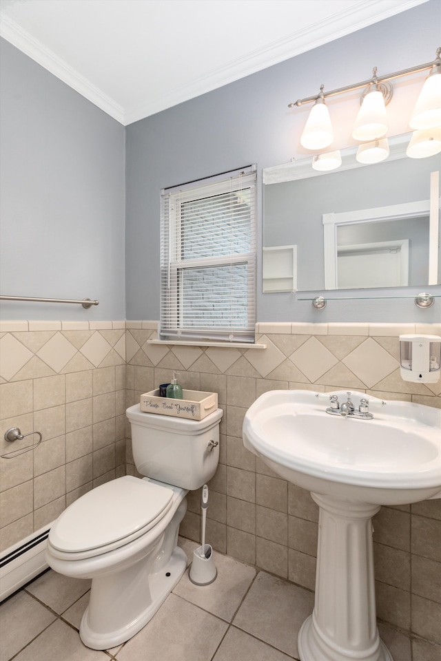 bathroom with tile patterned floors, a baseboard heating unit, toilet, and crown molding