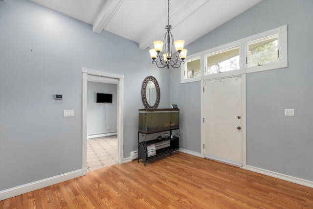 foyer featuring light wood finished floors, a chandelier, vaulted ceiling with beams, and a baseboard radiator