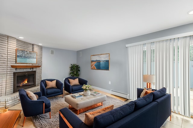 living area featuring visible vents, recessed lighting, a fireplace, a baseboard radiator, and baseboards