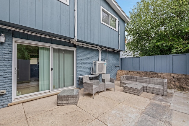 view of patio / terrace with an outdoor hangout area and fence