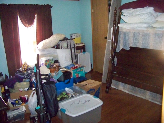 bedroom with wood finished floors