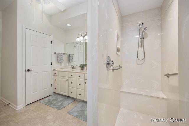 bathroom featuring walk in shower, vanity, and tile patterned flooring