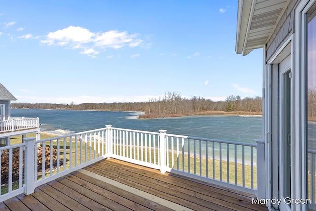 wooden deck featuring a water view