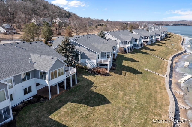 birds eye view of property with a residential view and a water view