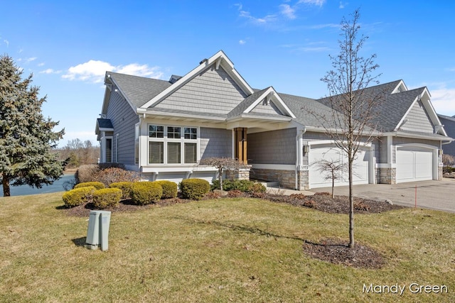 craftsman-style house with a front lawn, driveway, stone siding, a shingled roof, and a garage