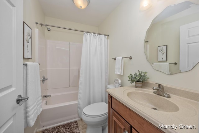 bathroom featuring vanity, toilet, and shower / bath combo with shower curtain