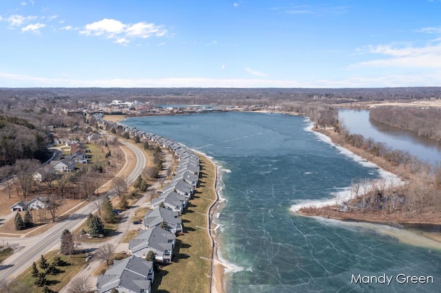 birds eye view of property with a water view