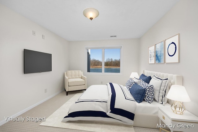 bedroom with visible vents, baseboards, and carpet flooring