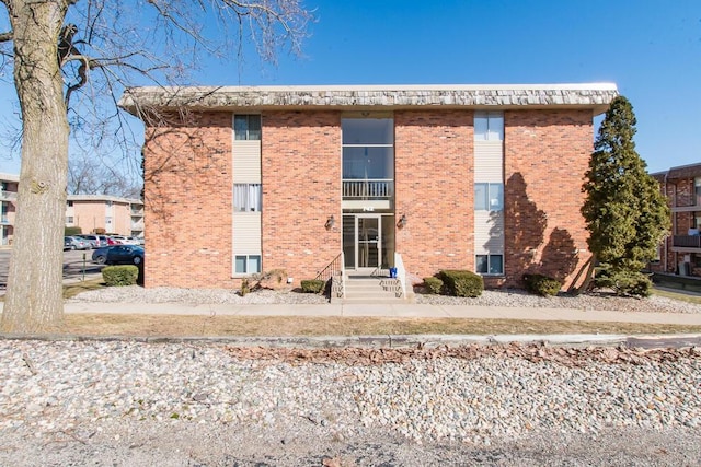 exterior space featuring brick siding