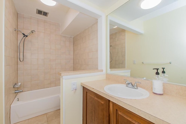 full bath with visible vents, vanity,  shower combination, and tile patterned flooring