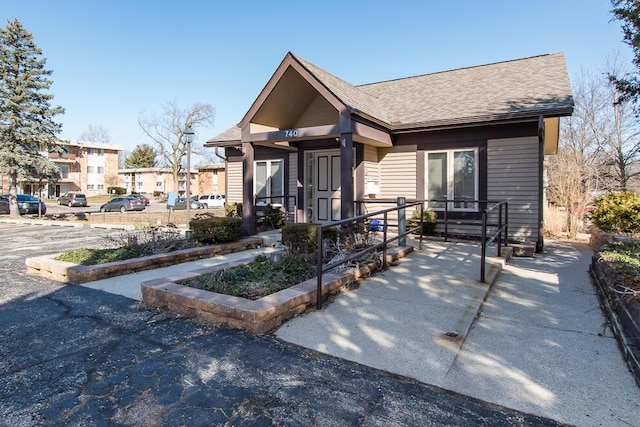 view of front of property with a shingled roof