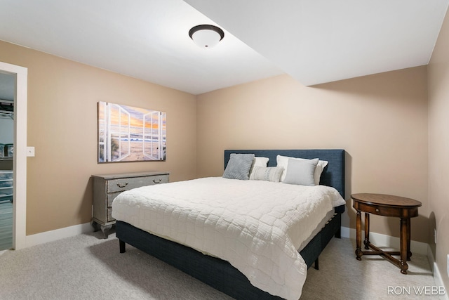 carpeted bedroom featuring baseboards