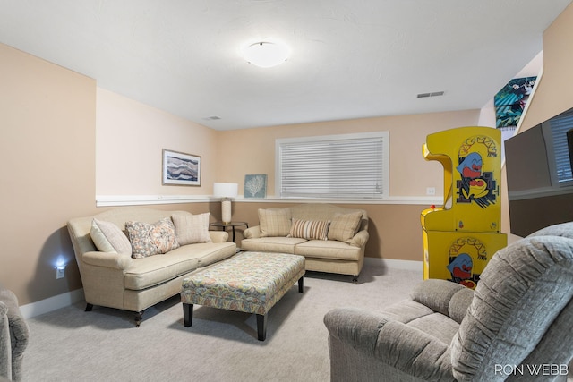 living room with carpet, visible vents, and baseboards