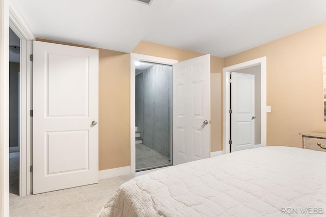 bedroom featuring carpet flooring, baseboards, and a closet