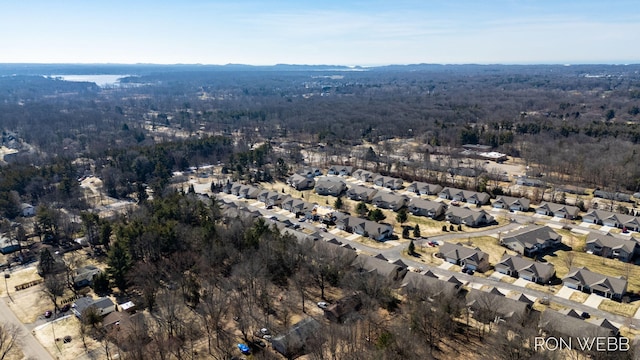 bird's eye view featuring a residential view and a forest view