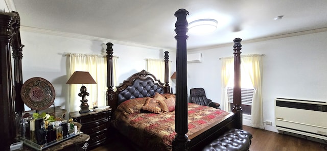 bedroom featuring heating unit, wood finished floors, an AC wall unit, and ornamental molding