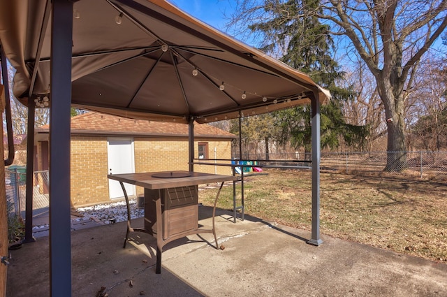 view of patio / terrace with a gazebo and fence