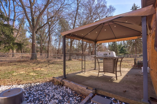 view of yard featuring a gazebo and a fenced backyard