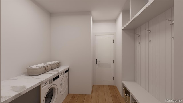 3721 W Kerriel Ct, Commerce Twp, MI 48382 - laundry room featuring light wood-type flooring and washing machine and dryer