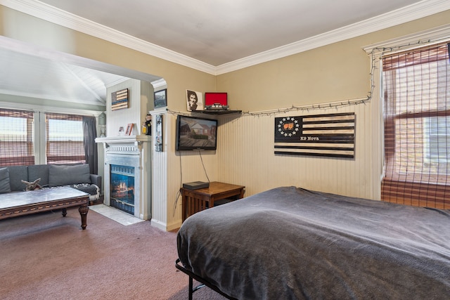 carpeted bedroom with a fireplace with flush hearth and ornamental molding