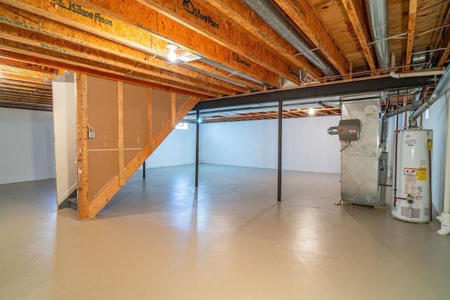 unfinished basement with water heater and heating unit