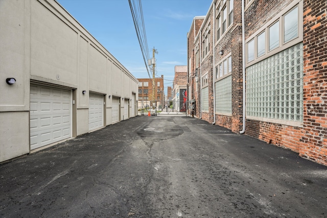 view of road with community garages