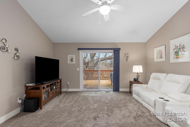 carpeted living room with baseboards, lofted ceiling, and a ceiling fan