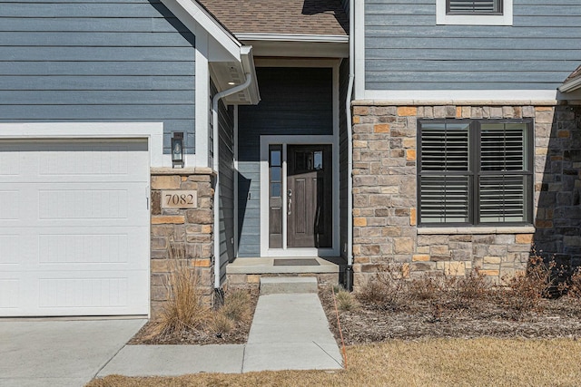 property entrance with stone siding and a shingled roof