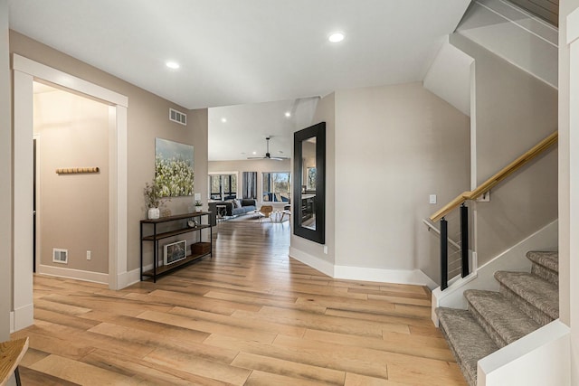 interior space featuring recessed lighting, visible vents, light wood-style flooring, and stairs