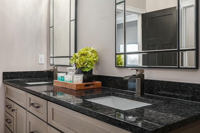 bathroom with double vanity and a sink