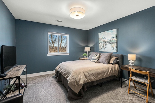 carpeted bedroom featuring visible vents and baseboards