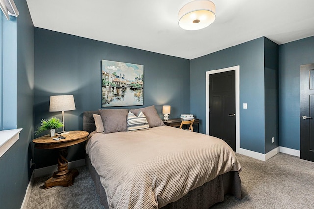 bedroom with baseboards and carpet floors