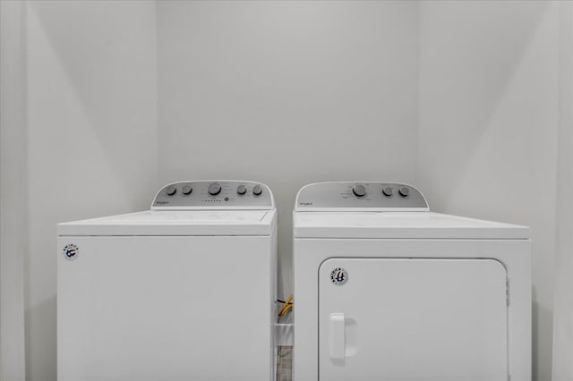 laundry room with washing machine and clothes dryer