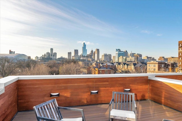 wooden deck with a city view