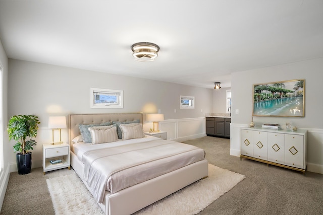 bedroom with light colored carpet