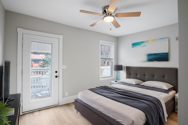 bedroom featuring baseboards, a ceiling fan, access to outside, and light wood-type flooring