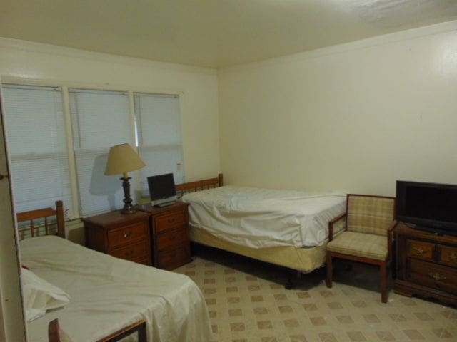 bedroom featuring crown molding