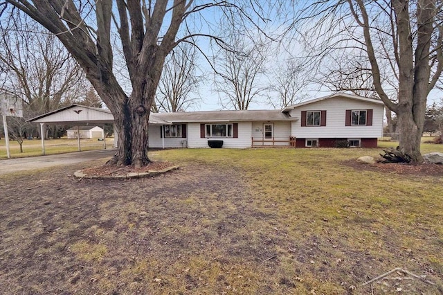 split level home with driveway and a front lawn