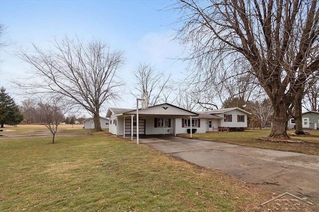 view of front of property with concrete driveway and a front lawn