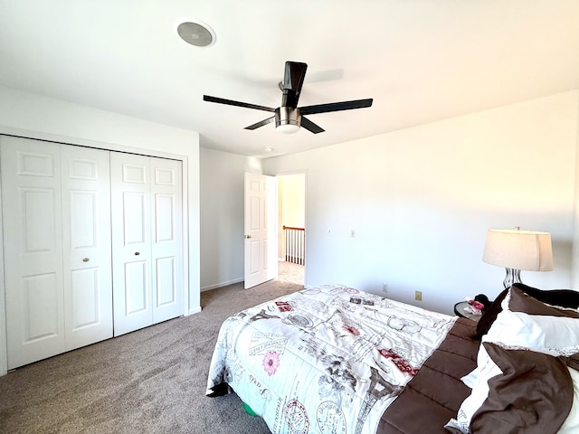 carpeted bedroom with a closet and a ceiling fan